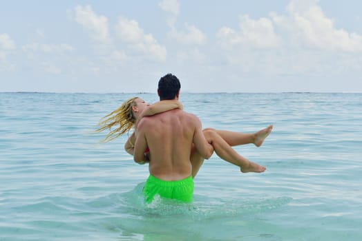 happy young  couple at summer vacation have fun and relax at beautiful sunny  day