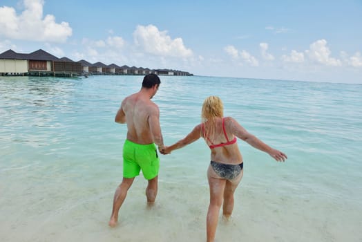 happy young  couple at summer vacation have fun and relax at beautiful sunny  day