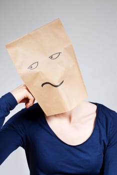 a person symbolizing boredom with a paper bag face