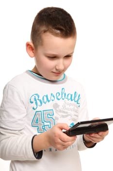 It shows a little boy holding a game console in his hand and visibly involved there.