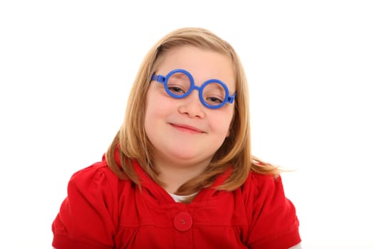 The photo shows a little student who has playing glasses on and smiles friendly into the camera.