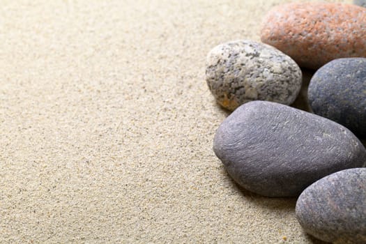 Pebble stones background. Sand beach texture. Macro shot