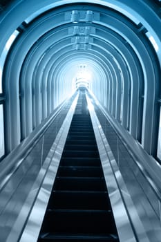 Contemporary blue moving escalator