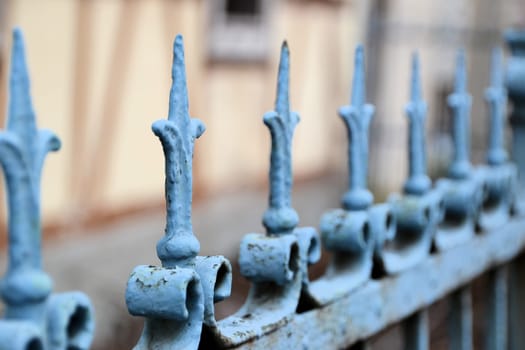 A metal fence in front of a house