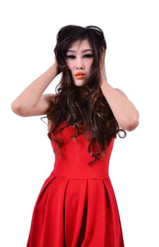 Sad beautiful woman standing against a white background