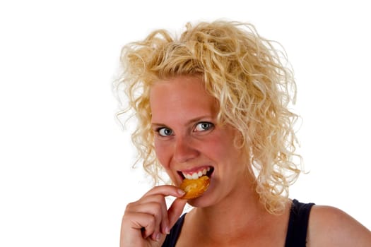 Young woman with biscuit isolated on white background