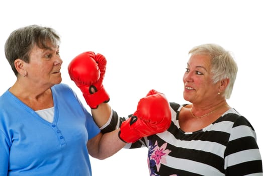 Senior women with boxing gloves - isolated on white background