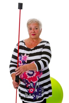 Senior woman with swinging stick and exercise ball - isolated on white background
