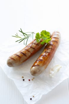Close up grilled sausage over the white background