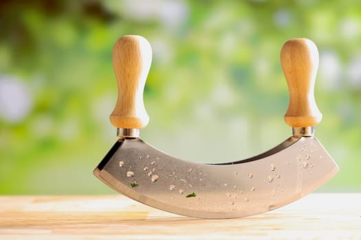 Close up of a modern herb cutter with a blurred background.