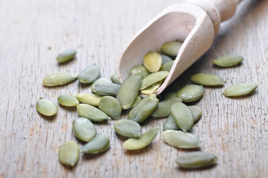 pumpkin seeds on a wooden table