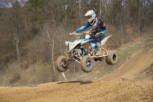 MOHELNICE,  CZECH REPUBLIC - APR 2013: Undefinied racer on quad motorbike in the "Crossracing Cup 2013""  in April 21, 2013, MOHELNICE, Czech Republic."