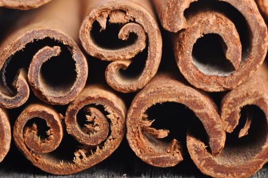 Stack of cinnamon stickson a wooden table