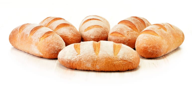 Composition with loafs of bread isolated on white background
