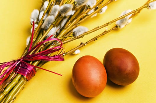 bunch of willow branches and two Easter eggs