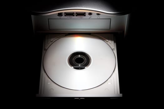 computer disk drive loaded with disk and isolated on white