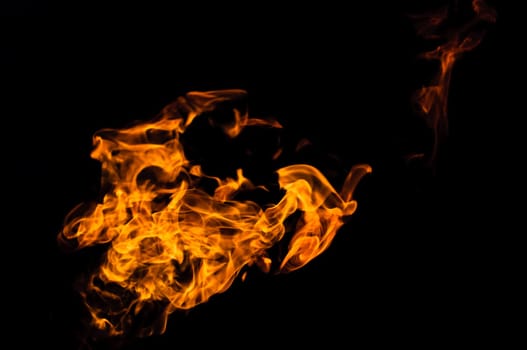 tongue of the flame over black background