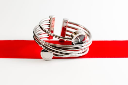 close up photo of femail fashion watches on a red stripe