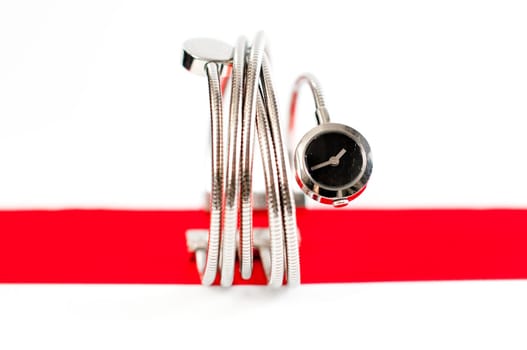close up photo of femail fashion watches on a red stripe