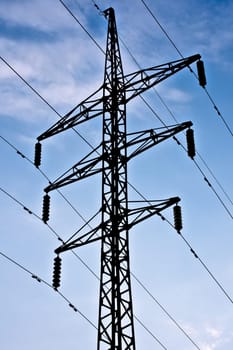 electric transmission line on blue sky background with clouds