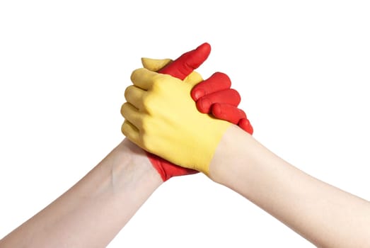 a yellow and a red hand competing or working together, isolated