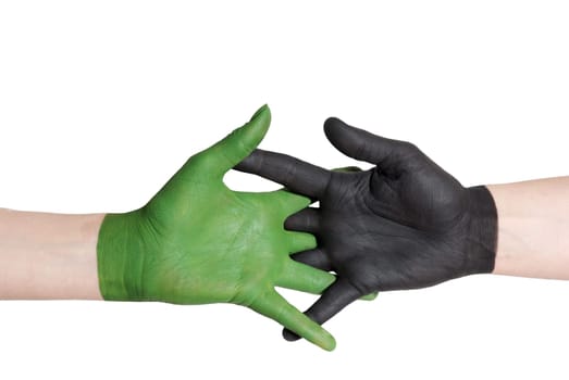 a handshake between a green and a black painted hand, isolated