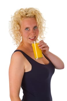 Young woman with a glass of orange juice isolated on white background