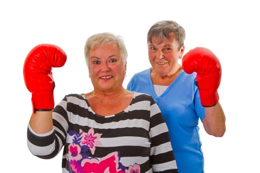 Senior women with boxing gloves - isolated on white background