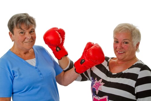 Senior women with boxing gloves - isolated on white background