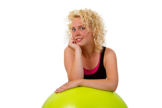 Young woman with exercise ball isolated on white background