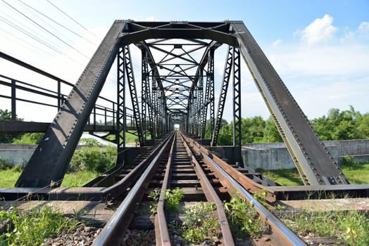 shot of metal structure bridge of train track