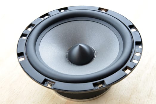 Closeup shot of Loud speaker on wooden plank