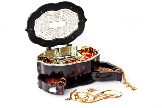 photo of the isolated on white jewelry chest with golden chains
