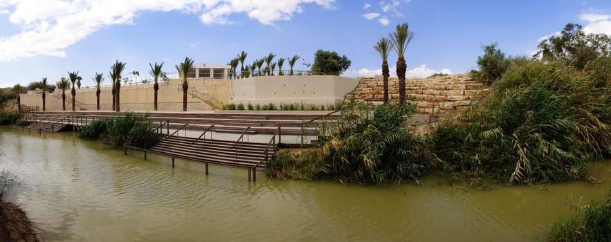 wide panorama of river Jordan. Blue cloudy sky in background, view on Israel