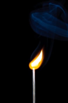 match burning with fire and smoke isolated on black background