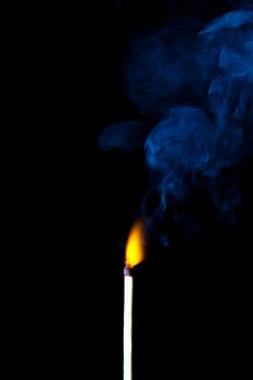 match burning with fire and smoke isolated on black background