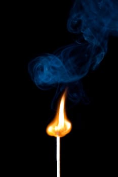 match burning with fire and smoke isolated on black background
