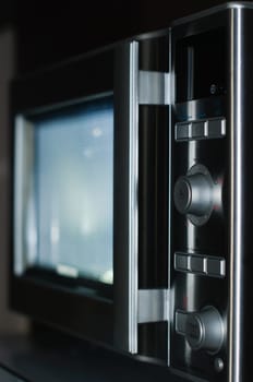 details of modern microwave oven in the kitchen