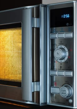 details of modern microwave oven in the kitchen