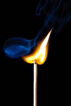 match burning with fire and smoke isolated on black background