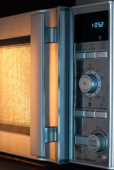 details of modern microwave oven in the kitchen