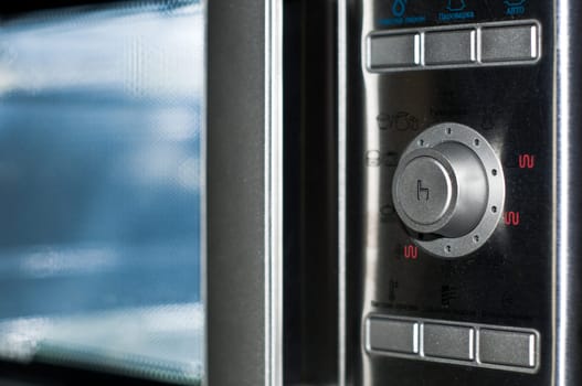 details of modern microwave oven in the kitchen