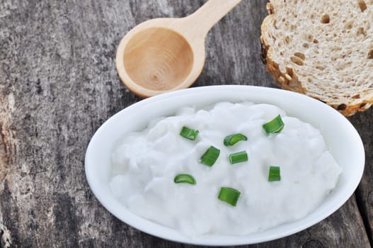 Cottage cheese on a wooden table