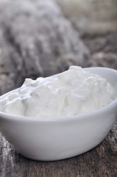 Cottage cheese on a wooden table