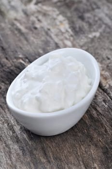 Cottage cheese on a wooden table