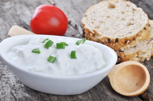 Cottage cheese on a wooden table