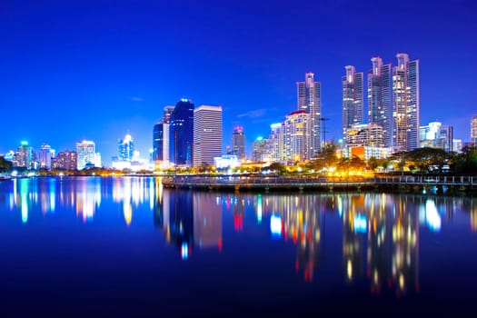 Bangkok city downtown at night with reflection of skyline, Bangkok,Thailand