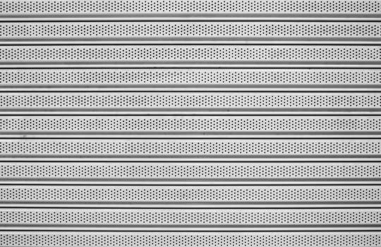 The metal has a straight line for the background.