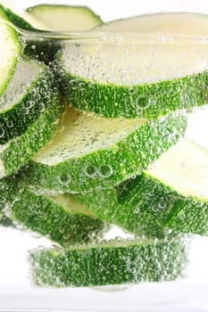 Zucchini sliced in water cooking