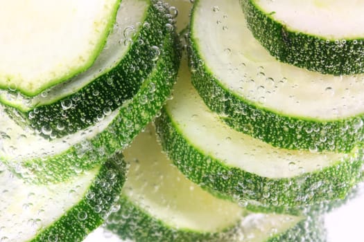 Zucchini sliced in water cooking